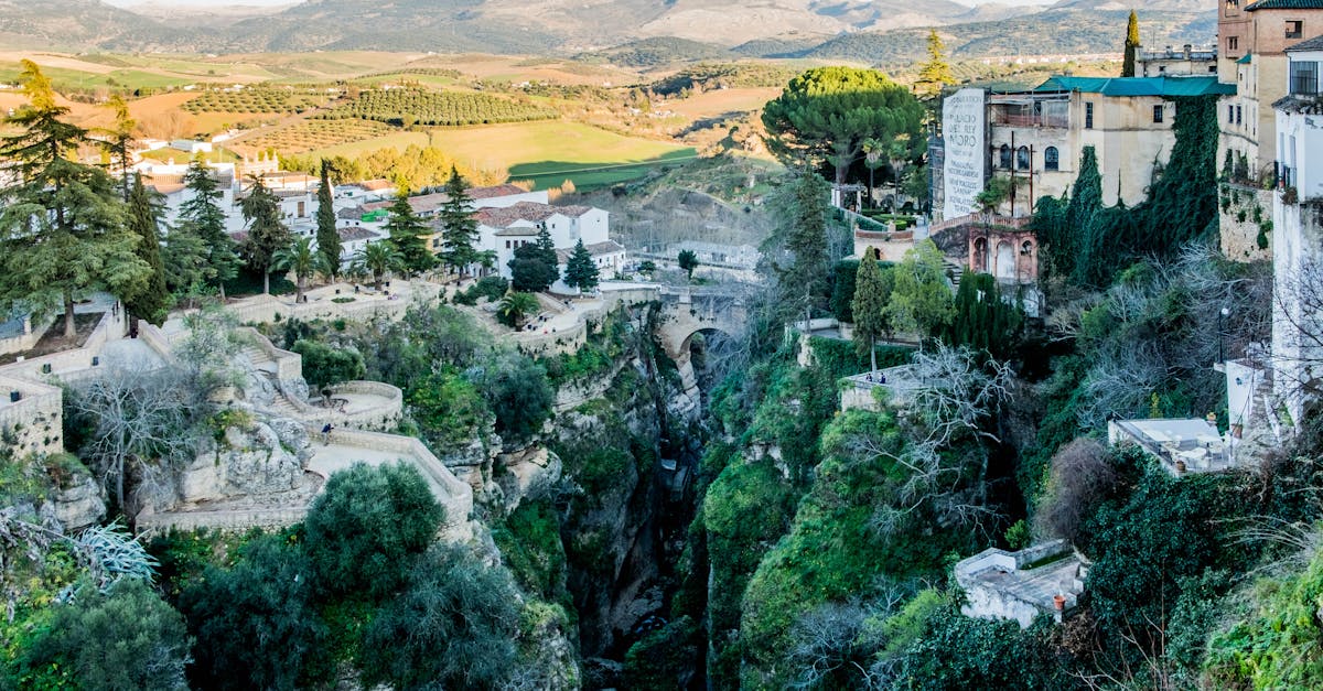 A breathtaking aerial view of the dramatic landscape and historic buildings of Ronda, Spain.