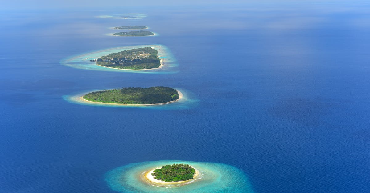 Stunning aerial shot of a chain of tropical islands in the Maldives surrounded by turquoise waters.