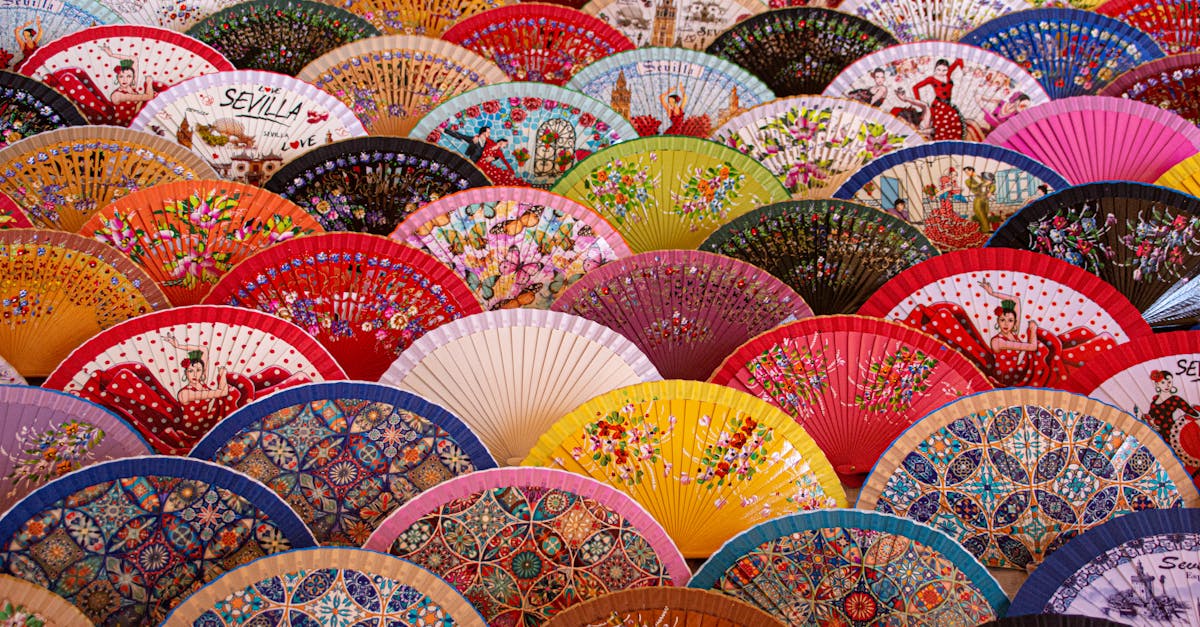 Vibrant display of traditional Spanish hand fans showcasing intricate designs in Sevilla.