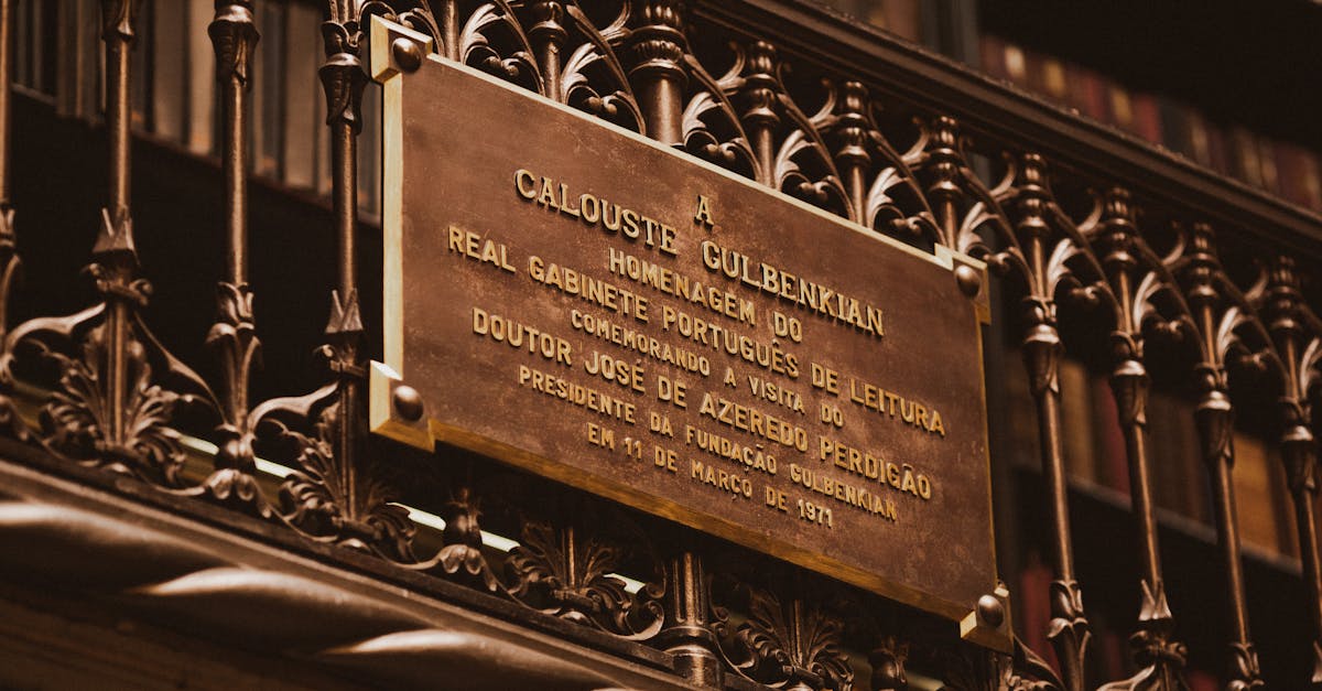 Close-up of a historic plaque honoring Calouste Gulbenkian at a library.