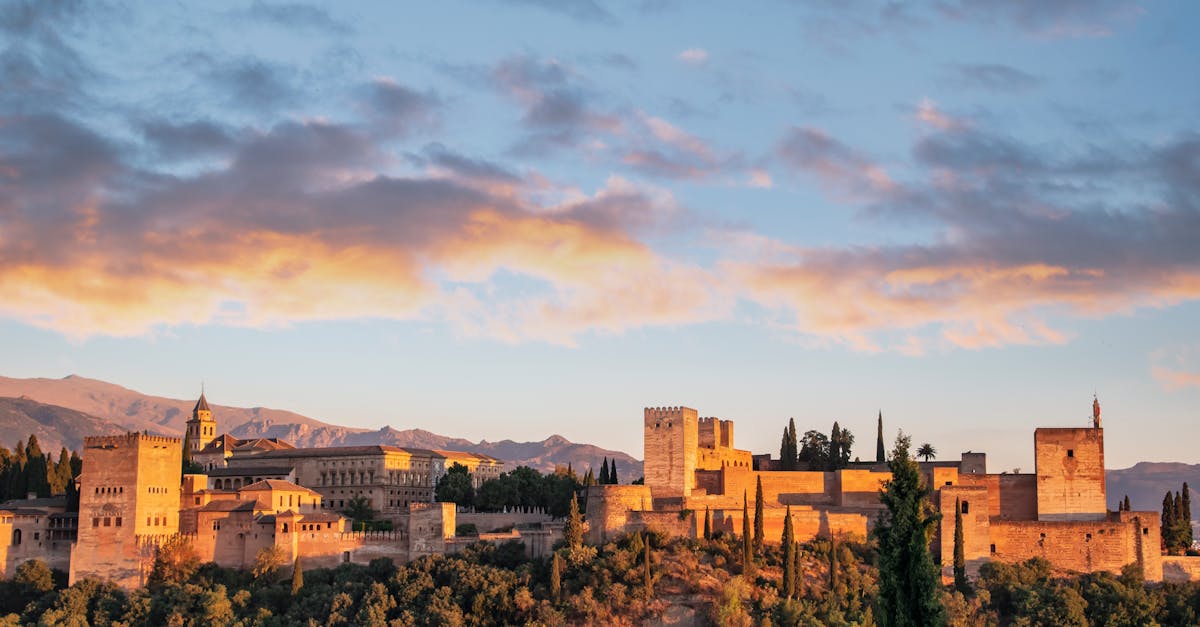 Stunning view of Alhambra Palace during sunrise in Granada, Spain.