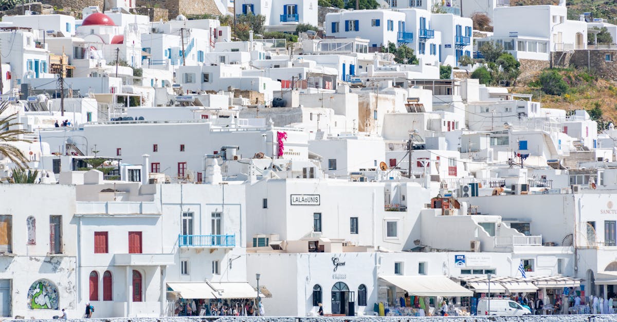 Stunning view of Mykonos' traditional white architecture along the crystal blue waterfront.