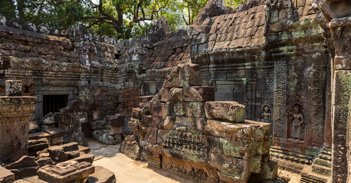 Explore ancient stone ruins of a temple in Cambodia, showcasing intricate carvings and rich cultural heritage.