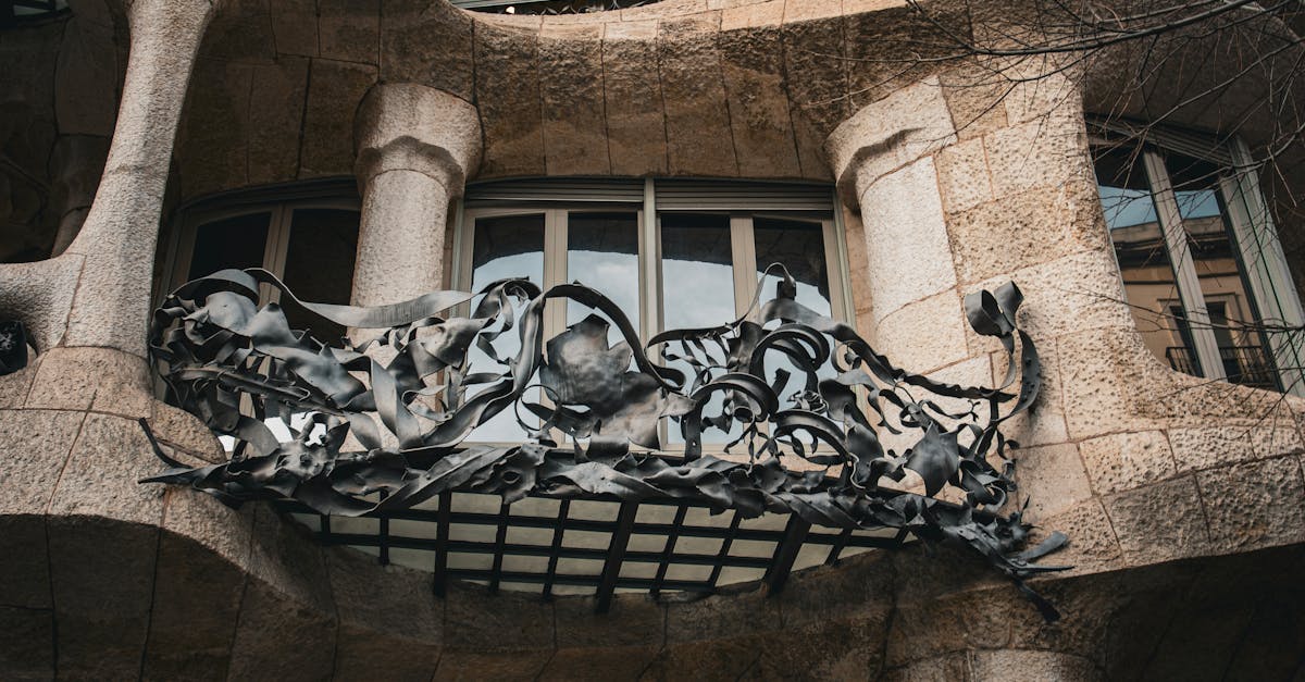 Detailed view of Casa Milà's artistic balcony in Barcelona.