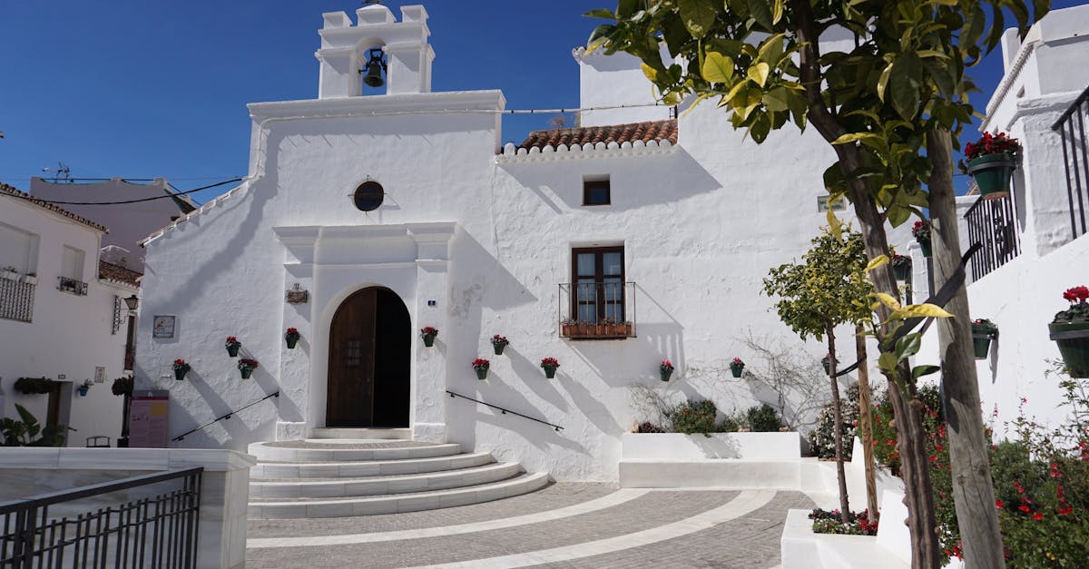 Beautiful white church facade in sunny Mijas, Spain, showcasing classic architecture.