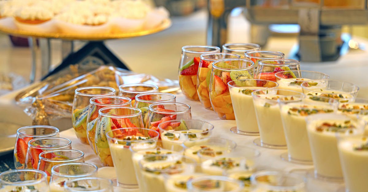 An exquisite dessert buffet featuring fresh fruit and yogurt parfaits, perfect for events.