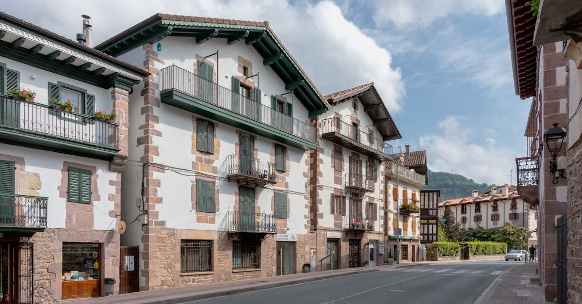 Scenic view of traditional stone buildings on a quiet street in Elizondo, Spain.