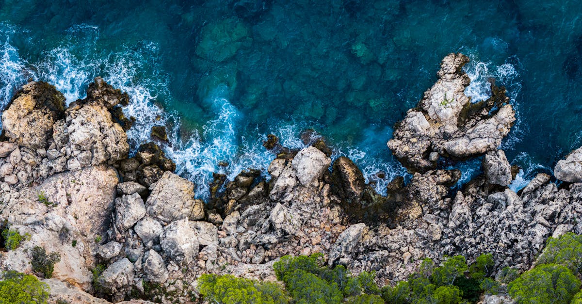 A breathtaking aerial view of the rocky coastline and blue waters in Marseille, France.