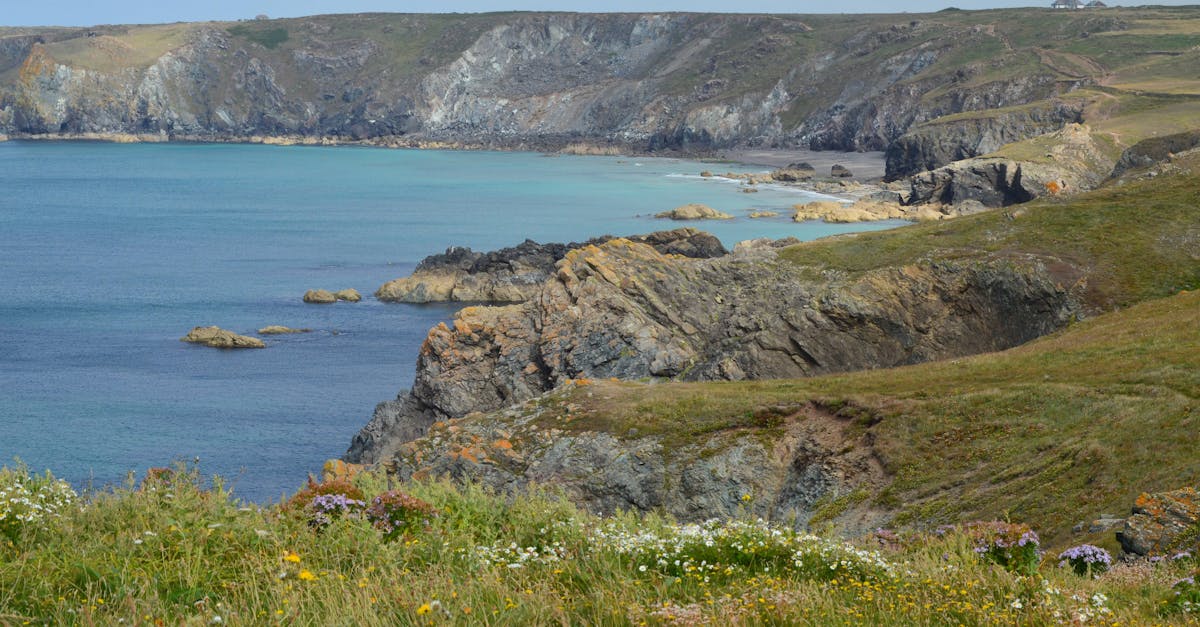 Breathtaking view of a rocky coastline with cliffs and clear blue sea.
