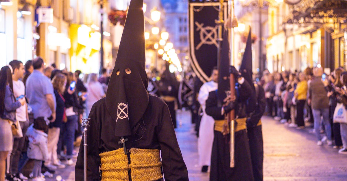 Traditional Easter procession with hooded participants in Zaragoza, Spain.