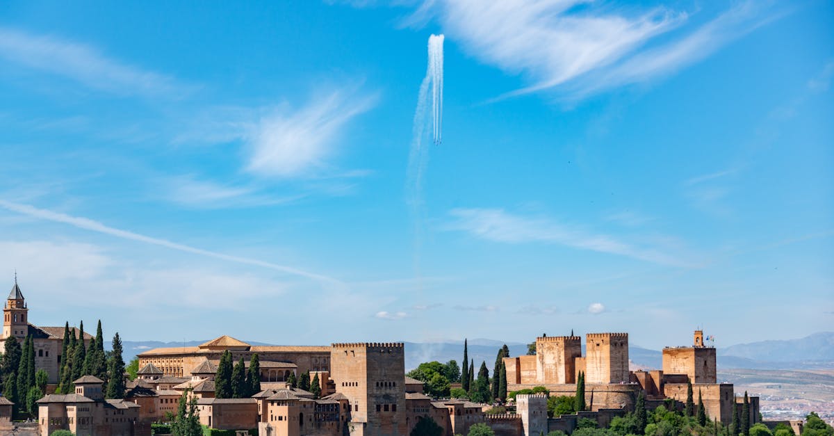 Stunning view of the Alhambra Palace set against a clear blue sky in Granada, Spain.