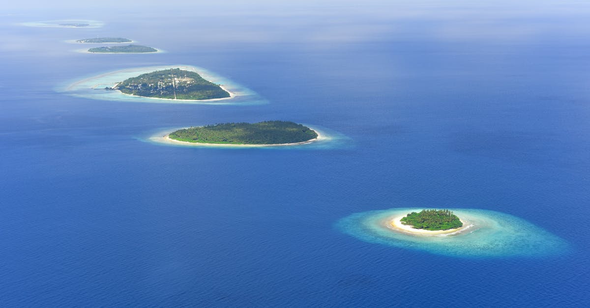 Discover the stunning aerial view of lush tropical islands surrounded by azure ocean waters.