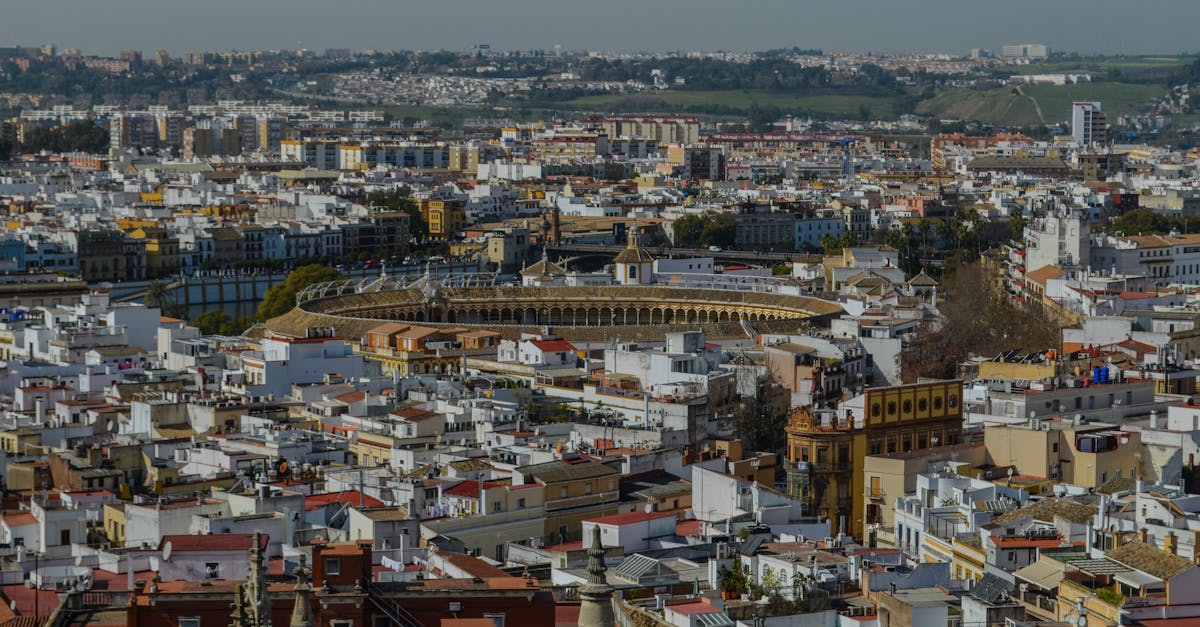 A stunning aerial view of Seville showcasing the iconic bullring and surrounding historic architecture.