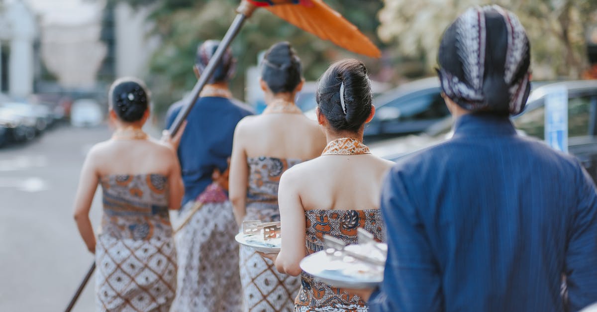 A cultural parade in Yogyakarta showcasing traditional Indonesian attire and ceremonial elements.