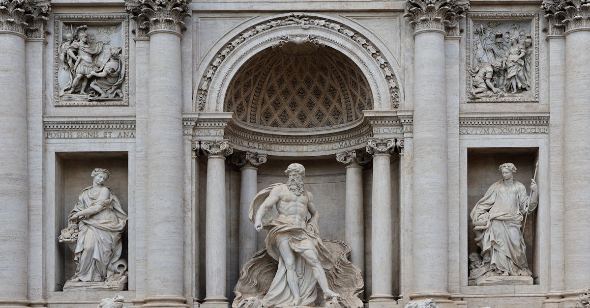 Close-up of Trevi Fountain statues showcasing classic Roman architecture and sculptures.