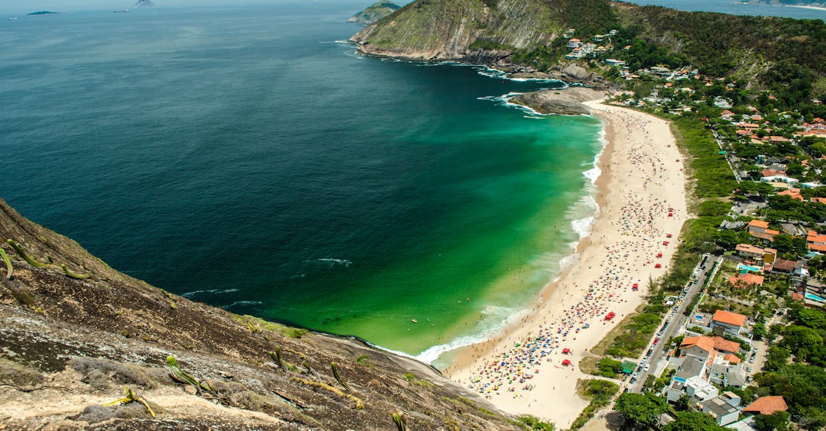 Stunning aerial view of Itacoatiara Beach in Niterói, showcasing the vibrant shoreline and lush landscape.