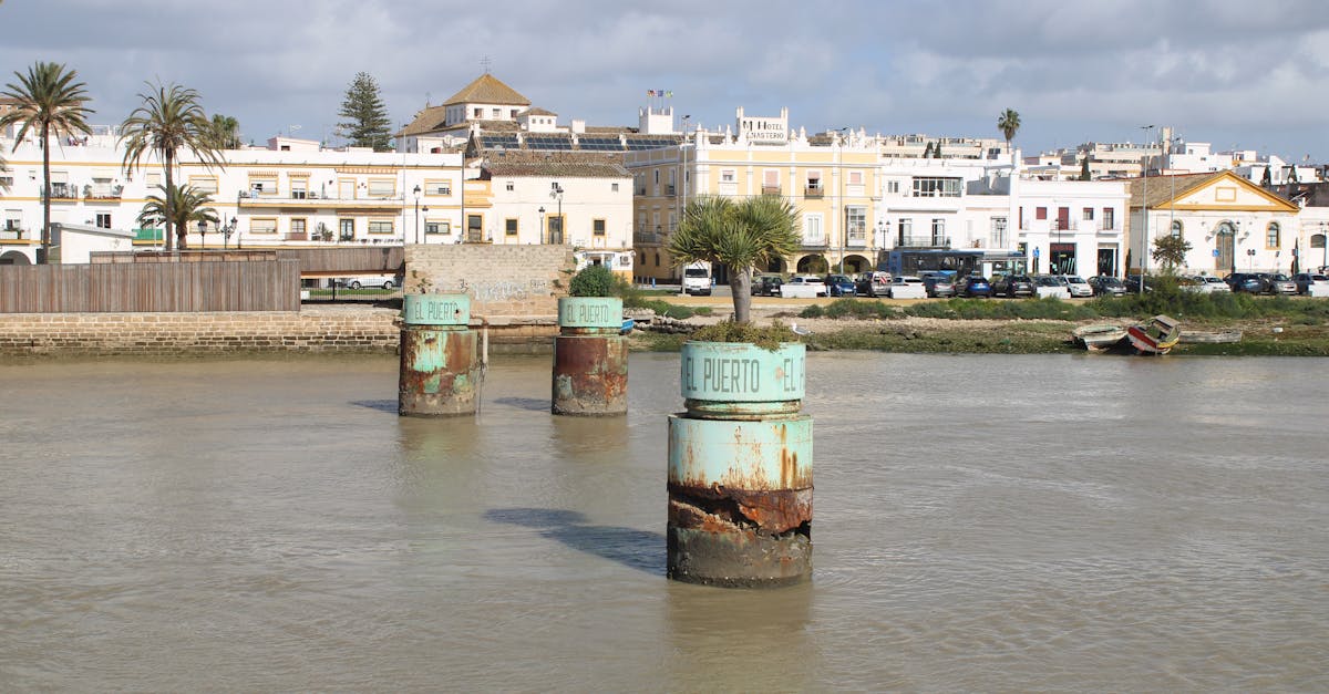 Picturesque riverfront scene in El Puerto de Santa María, showcasing architectural heritage and serene waters.