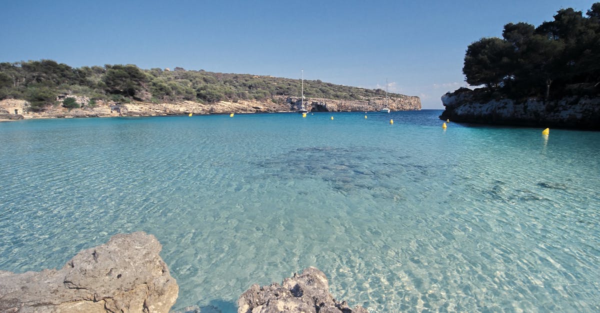 Crystal clear waters of a picturesque cove in Minorca, Balearic Islands.