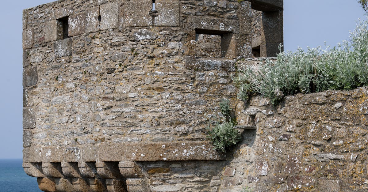 Ancient stone fort overlooking the sea in Brittany, France, highlighting medieval architecture.