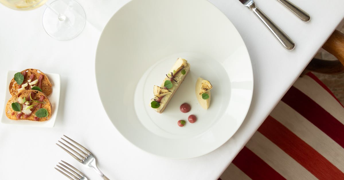 Top view of gourmet French cuisine in a fine dining setup, Vonnas, France.
