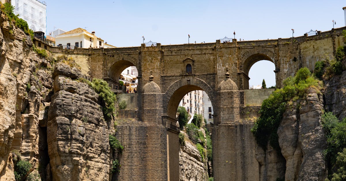 Dramatic view of the Puente Nuevo bridge in Ronda, connecting cliffs over El Tajo Gorge.
