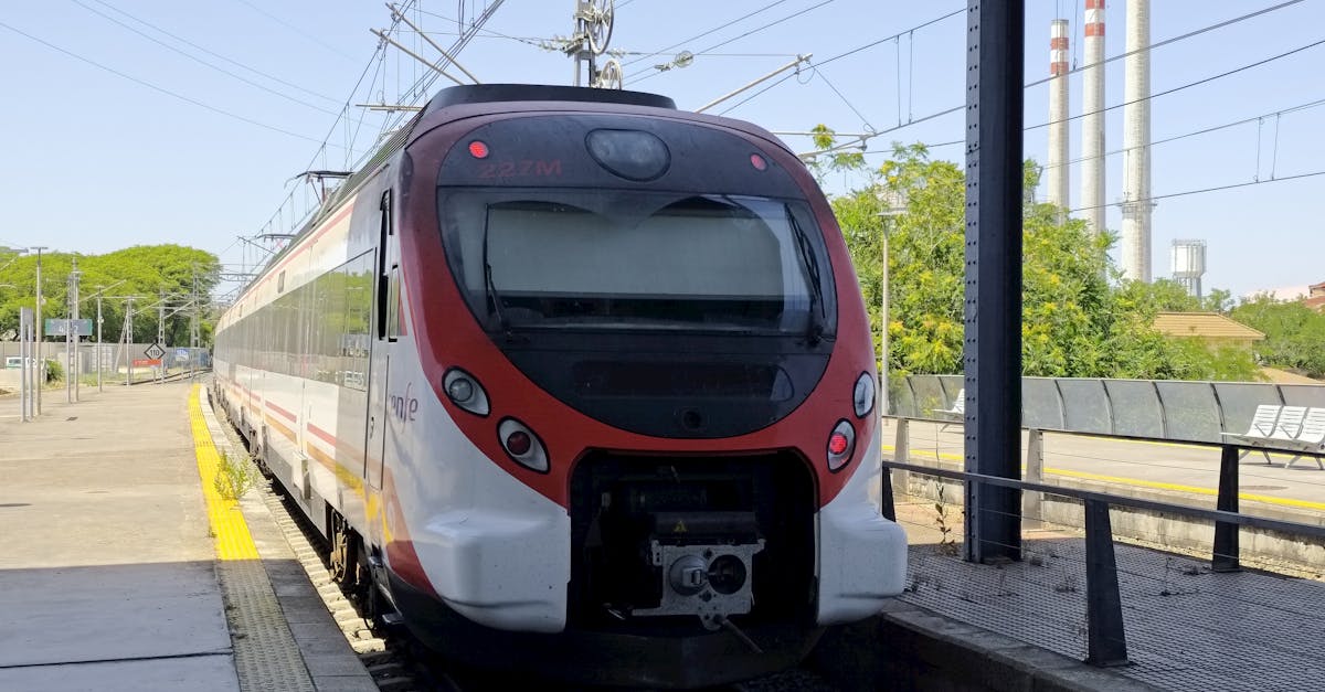Passenger train at a railway station in Cadiz, Spain on a sunny day.