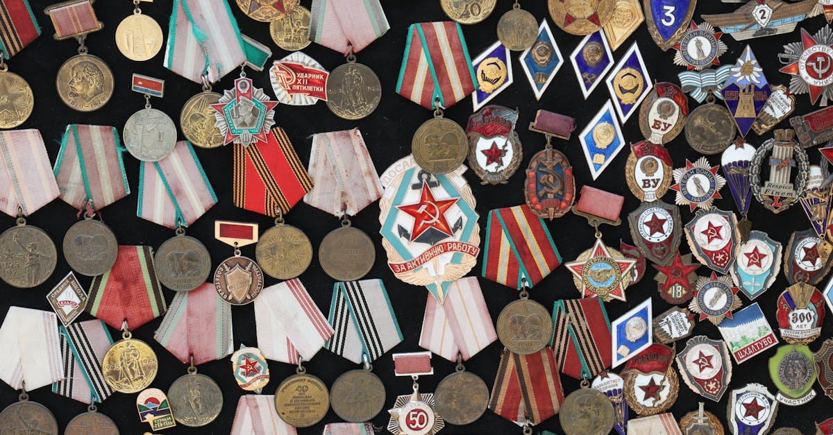 Vintage collection of Soviet military medals and badges displaying historical designs.