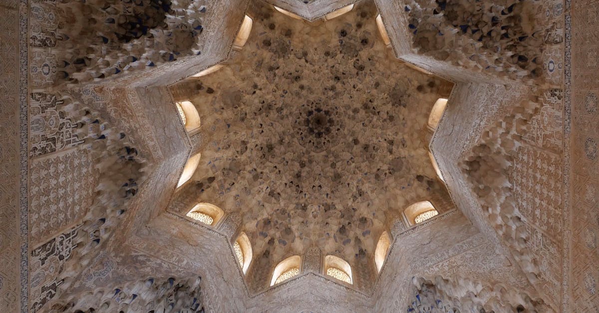 Explore the stunning ceiling architecture of the Alhambra in Granada, showcasing Moorish artistry.
