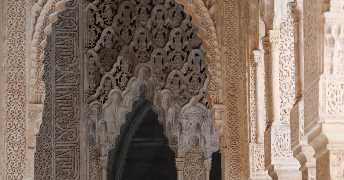 Explore the exquisite Moorish architectural detailing in the historic Alhambra Palace, a UNESCO World Heritage Site.