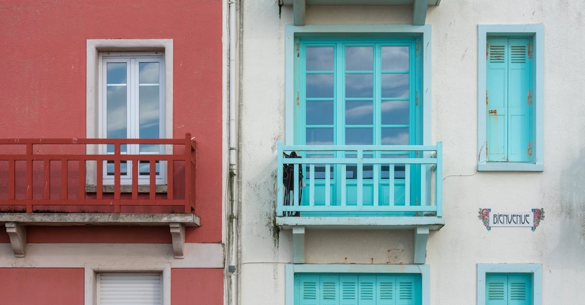 Vibrant red and blue façades with balconies, capturing urban architectural design.