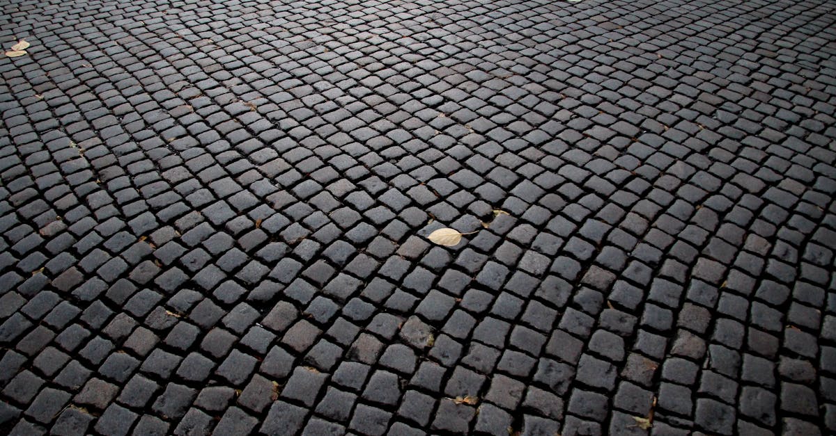 Detailed view of cobblestone pavement pattern in Katowice, Poland, highlighting its historic charm.