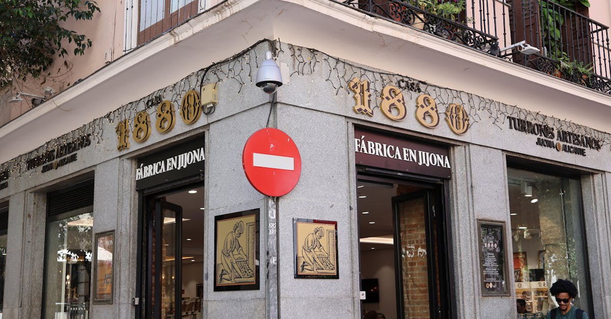 Exterior of a historic nougat shop in Alicante, Spain, showcasing traditional architecture.