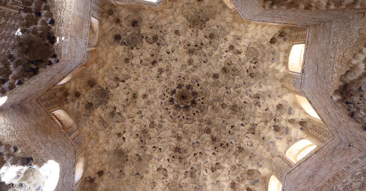 Detailed view of the dome ceiling in Alhambra, Granada showcasing Moorish architecture.