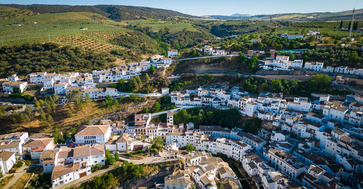 Stunning aerial view of Setenil de las Bodegas, featuring whitewashed houses nestled in the Andalusian hills.
