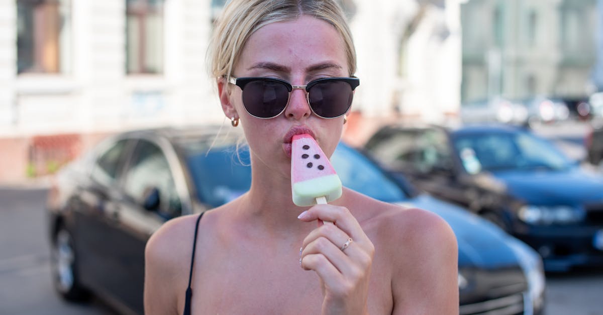 A young woman savors a watermelon popsicle on a sunny day in Split, Croatia.