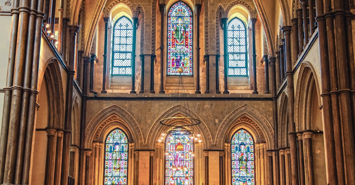 Stunning view of a Gothic cathedral interior showcasing ornate stained glass windows and arches.
