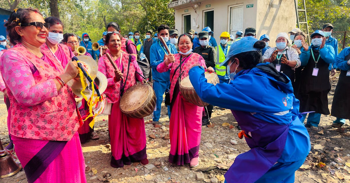 People celebrating outdoors with traditional Nepali drums and attire in Butwal.