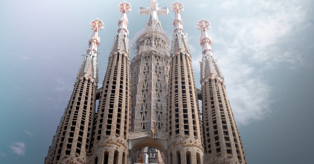Stunning view of Sagrada Familia's intricate towers against a clear sky in Barcelona.