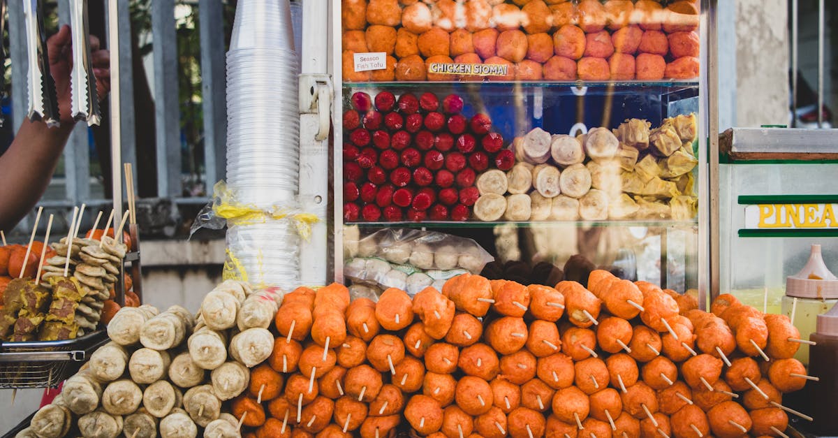 Street food stall featuring assorted Filipino snacks in Manila, Philippines.