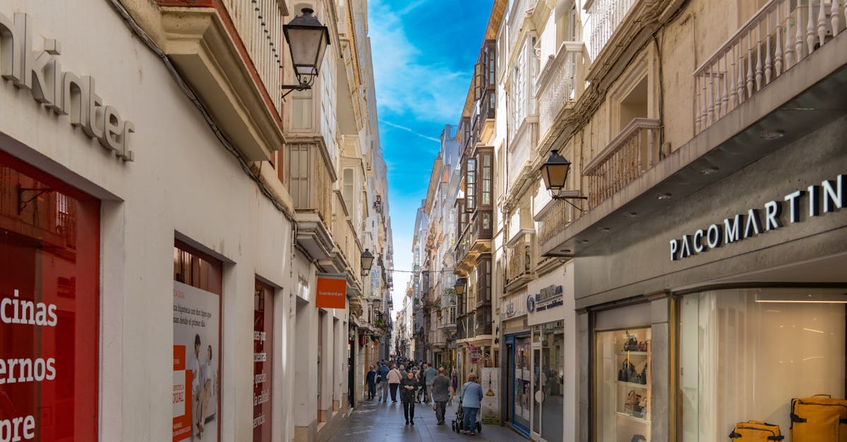 Explore the vibrant shopping street in Cádiz, capturing the essence of Andalusian architecture and culture.