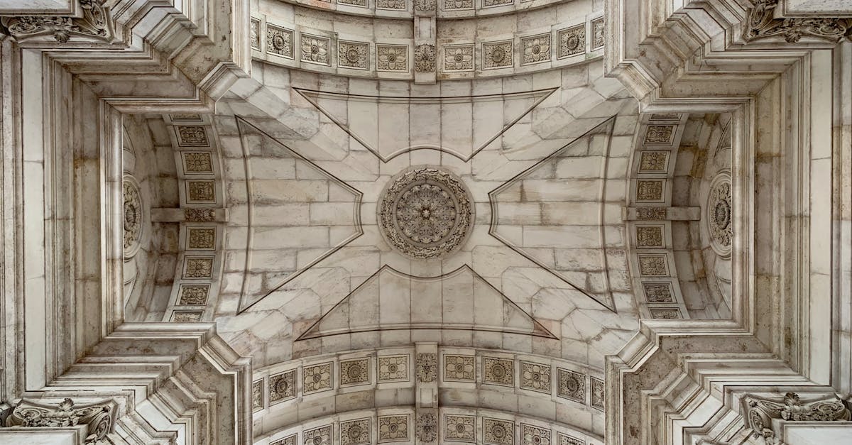 Detailed view of the Arco da Rua Augusta's ornate ceiling in Lisbon, showcasing intricate architecture.