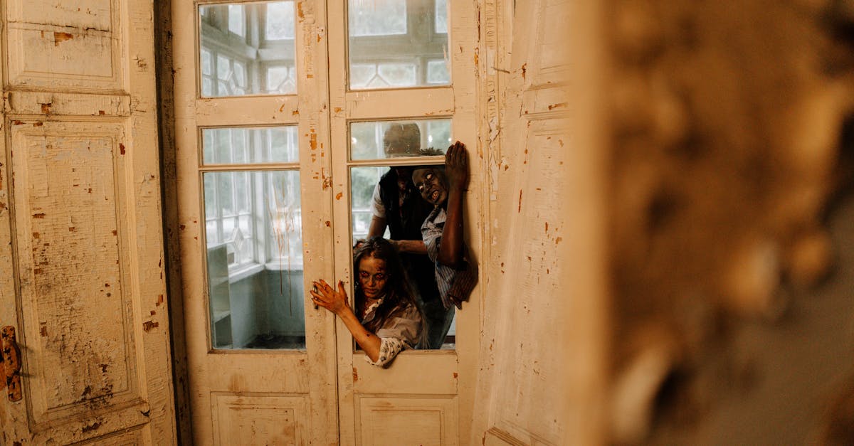 Spooky horror scene with zombies breaking through an old wooden door, perfect for Halloween themes.