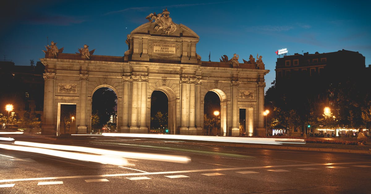 Long exposure of Puerta de Alcalá illuminated at night in Madrid, Spain.