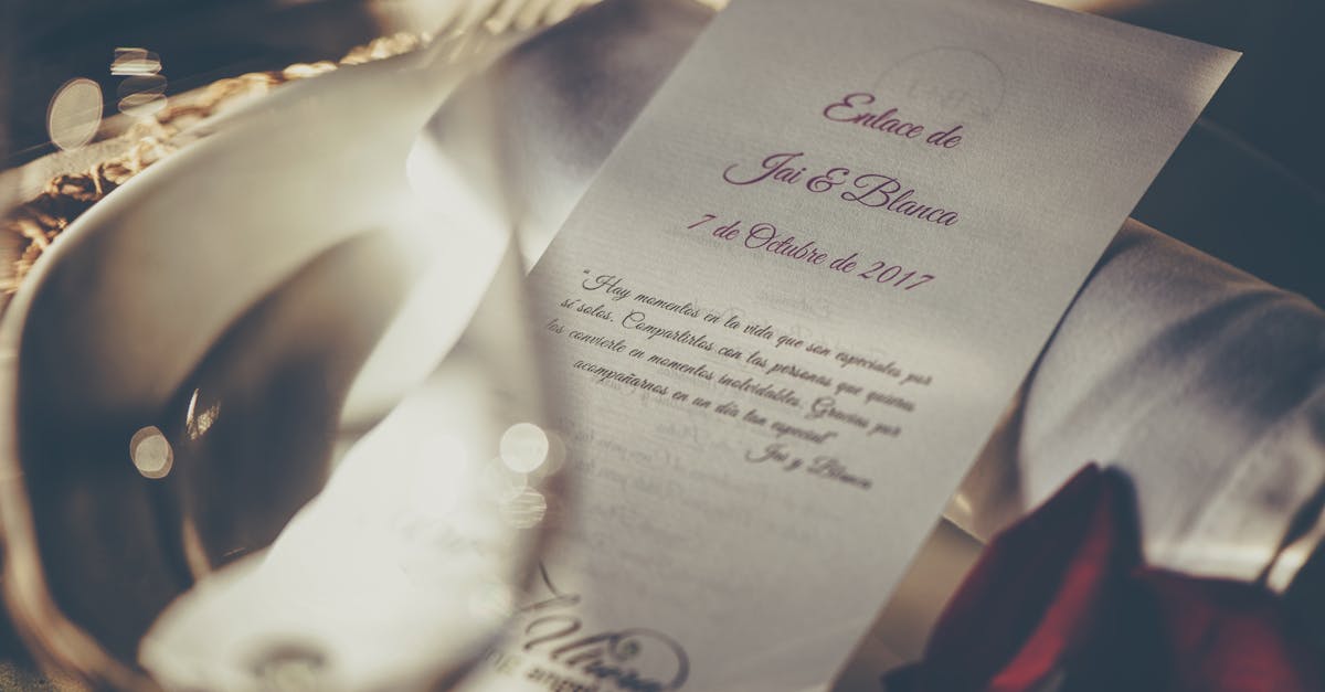 A romantic wedding invitation featuring elegant calligraphy, captured in soft focus for a dreamy feel.