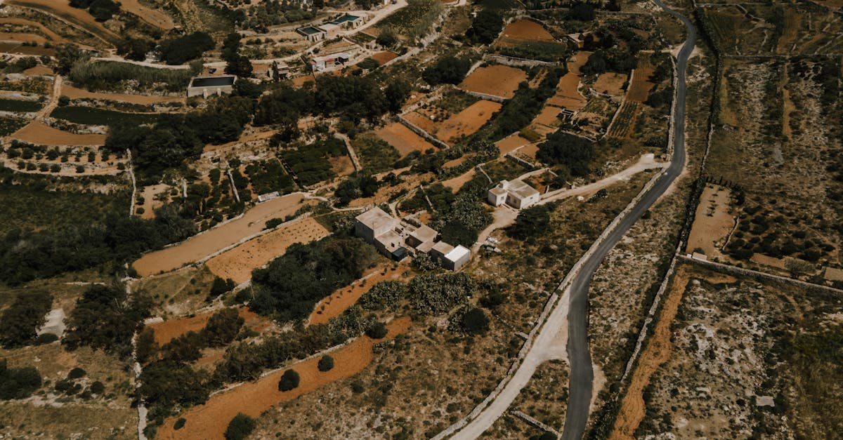 Drone view of the picturesque rural landscape in Ħad-Dingli, Malta, showcasing farms and winding roads.