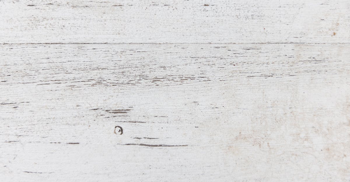 Close-up of a textured rustic white wooden surface, ideal for backgrounds.