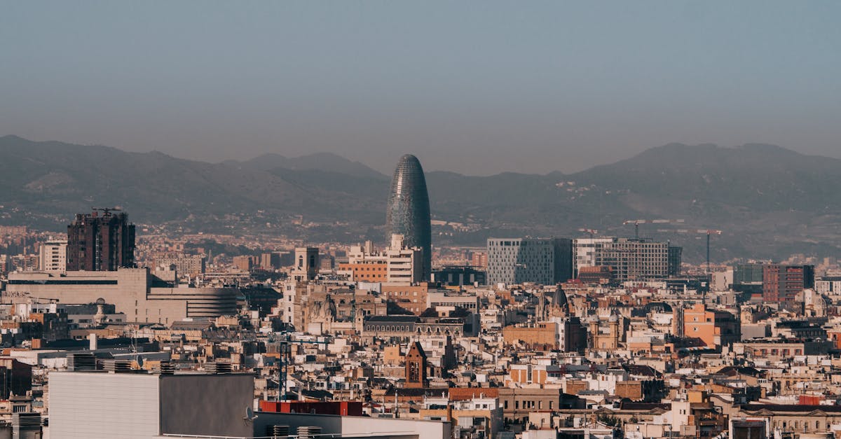 A panoramic view of Barcelona's skyline with Torre Glòries during a clear morning.
